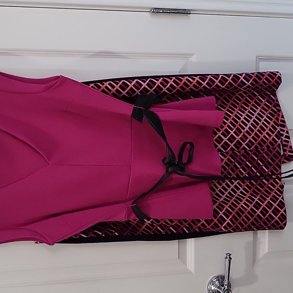 Cute pink top with knee length skirt. Very pretty.